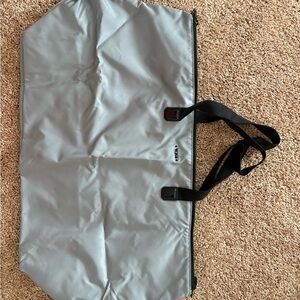 Tumi Silver Travel Tote with Black Straps